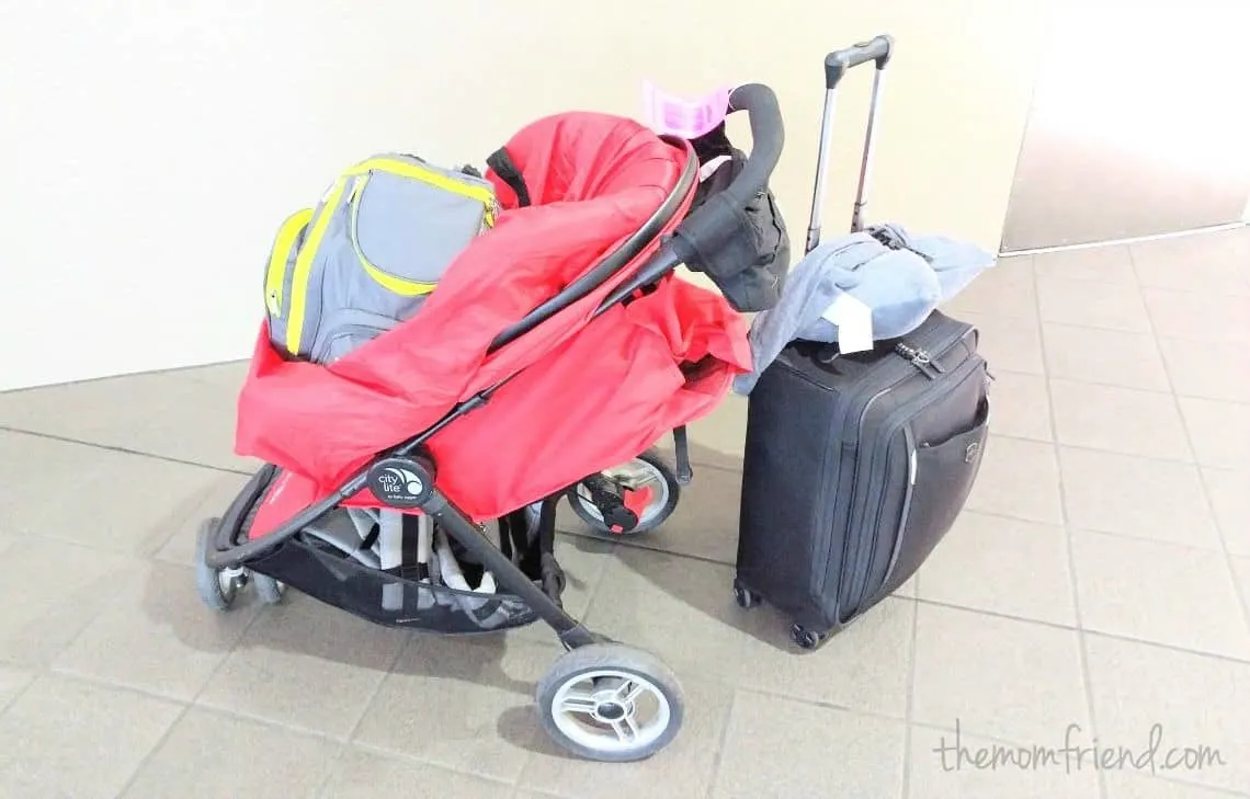 Stroller and luggage packed for travel.