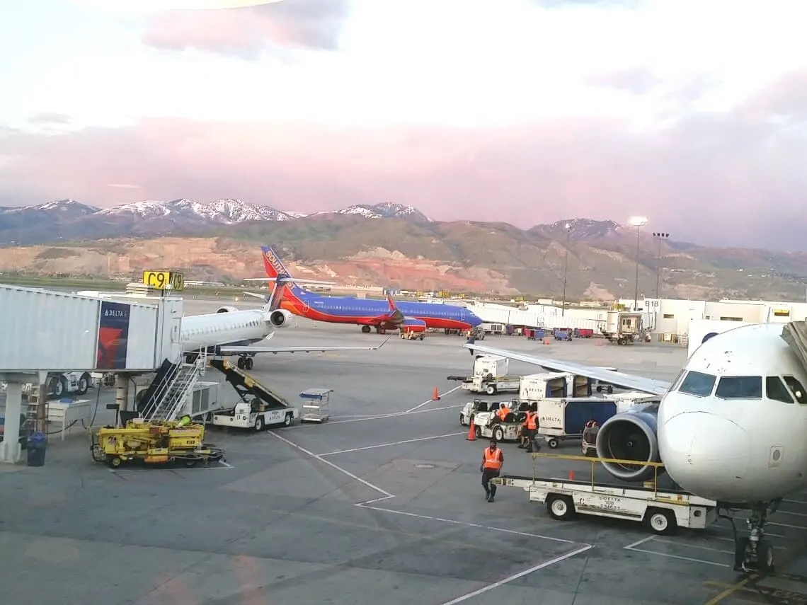 A large passenger jet sitting on top of an airport tarmac.