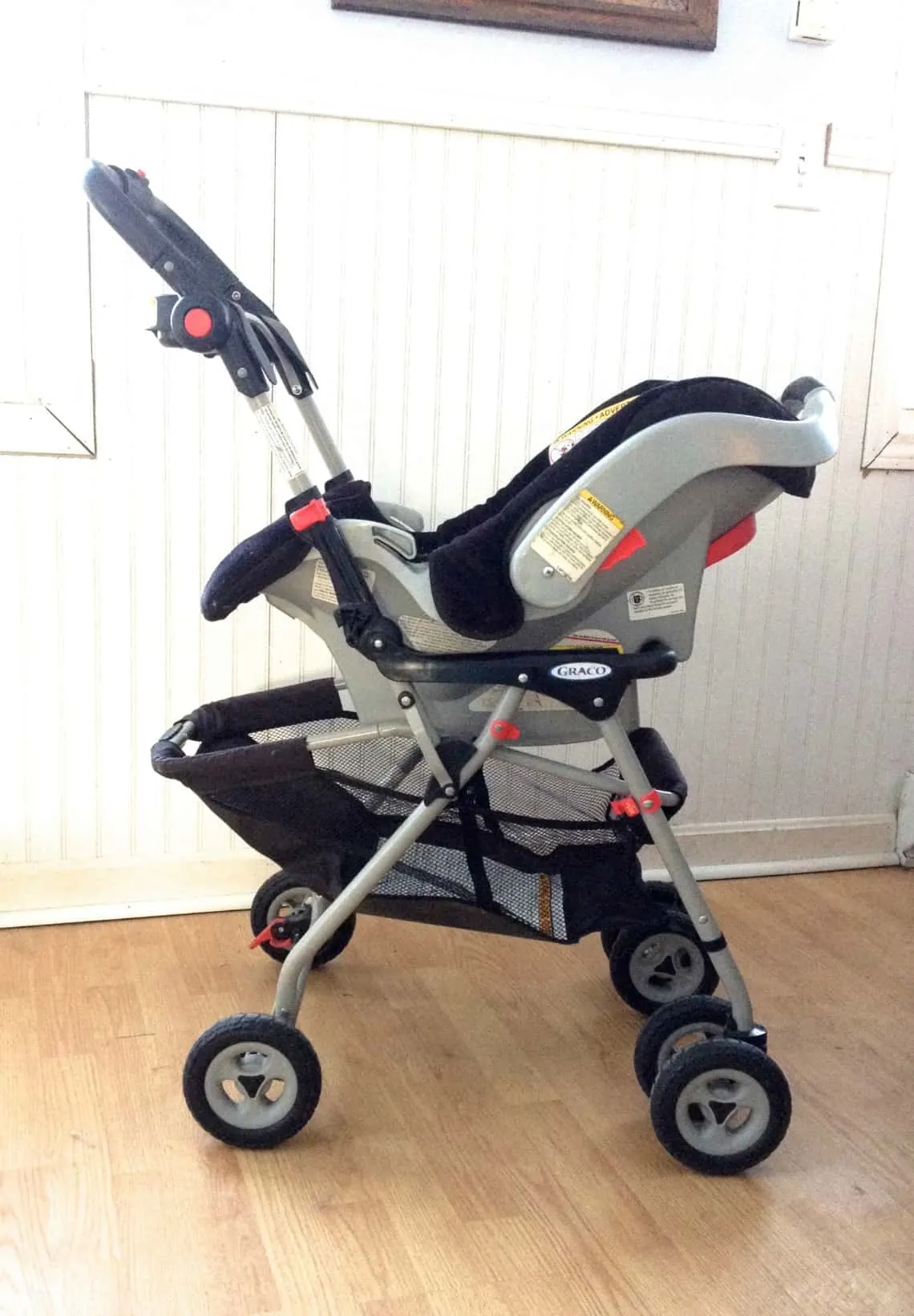 Stroller frame with car seat attached.