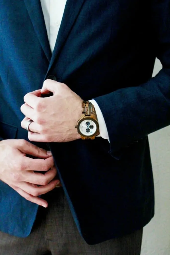 Man in suit wears Jord watch.