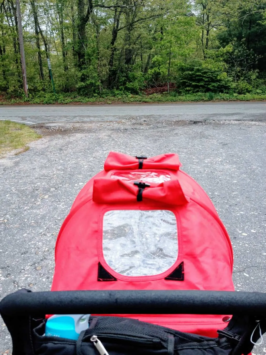 View overlooking the top of red jogging stroller.