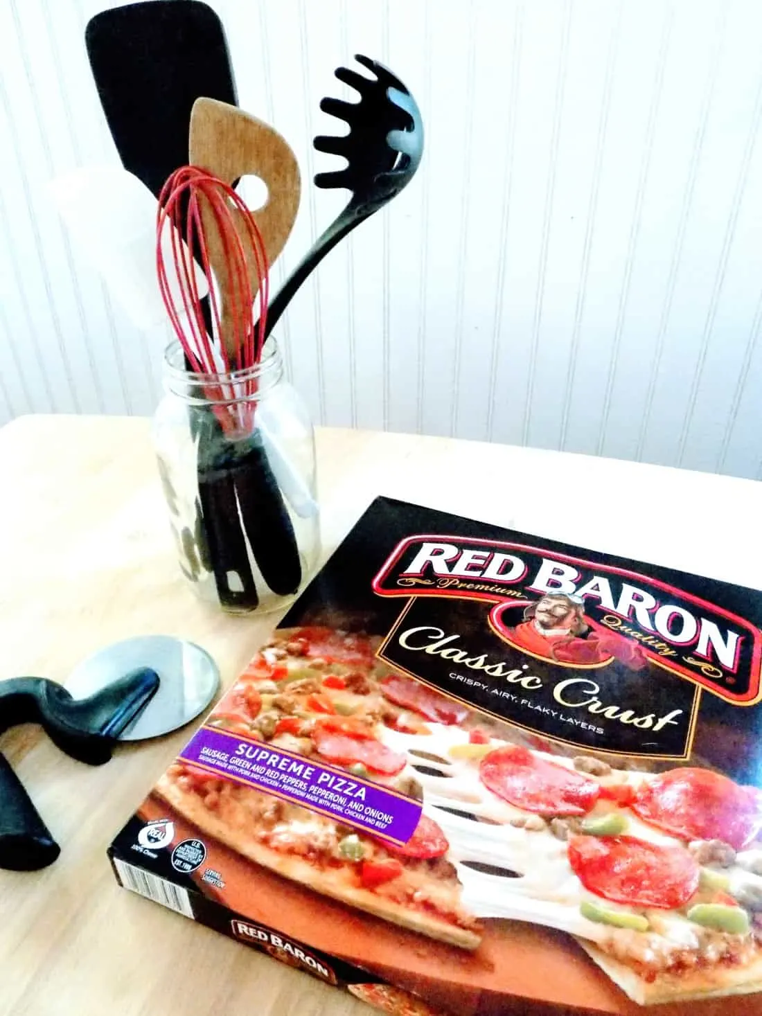 Box of Red Baron pizza on counter.