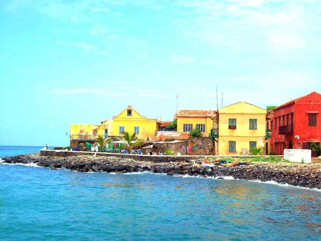 Colorful buildings next to shore.