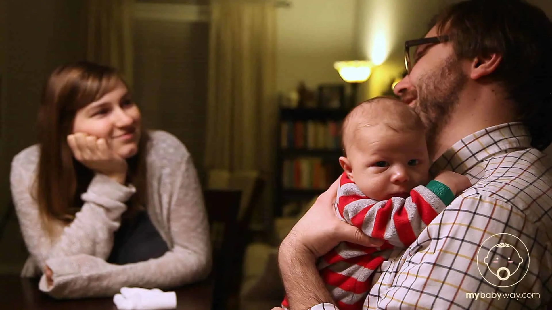 Man holds baby boy.