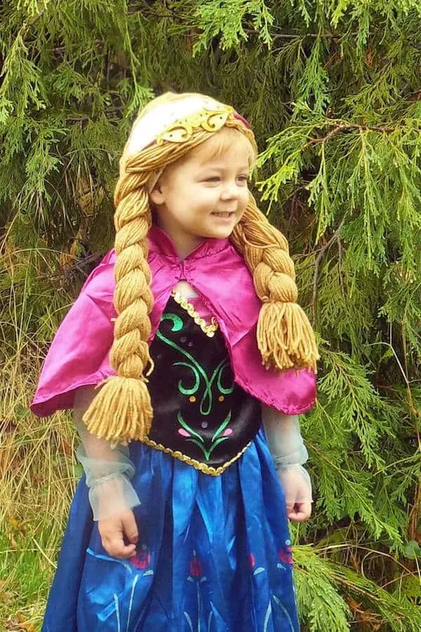 Girl wears frozen costume for Halloween.