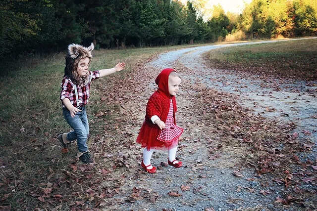 Girl and boy wear Little Red Riding Hood sibling costume for Halloween.