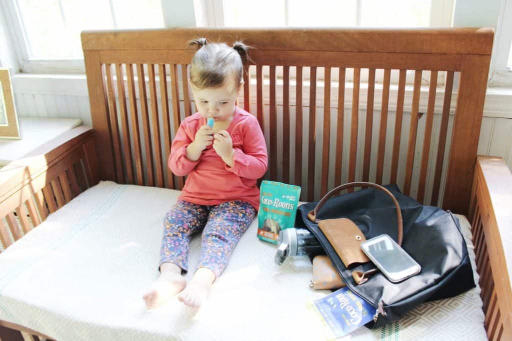 Little girl gets ready to leave her home for the day.