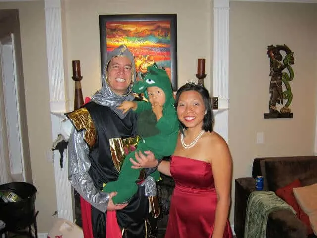 Family wears Knight and Dragon costumes for Halloween.