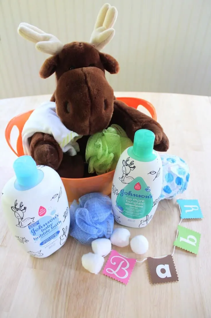 Moose stuffed animal and skin care products for babies.