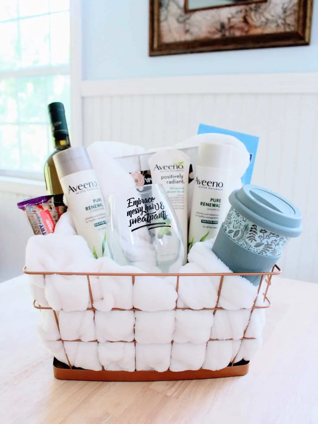 Gift basket filled with comforting items for new moms.