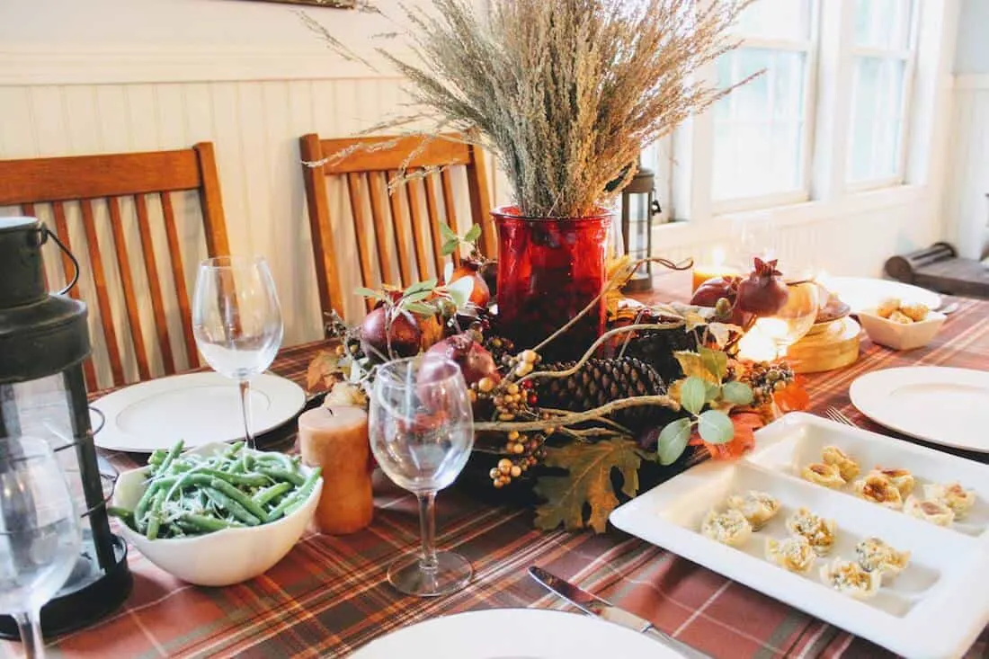 Table decor for Thanksgiving and food.
