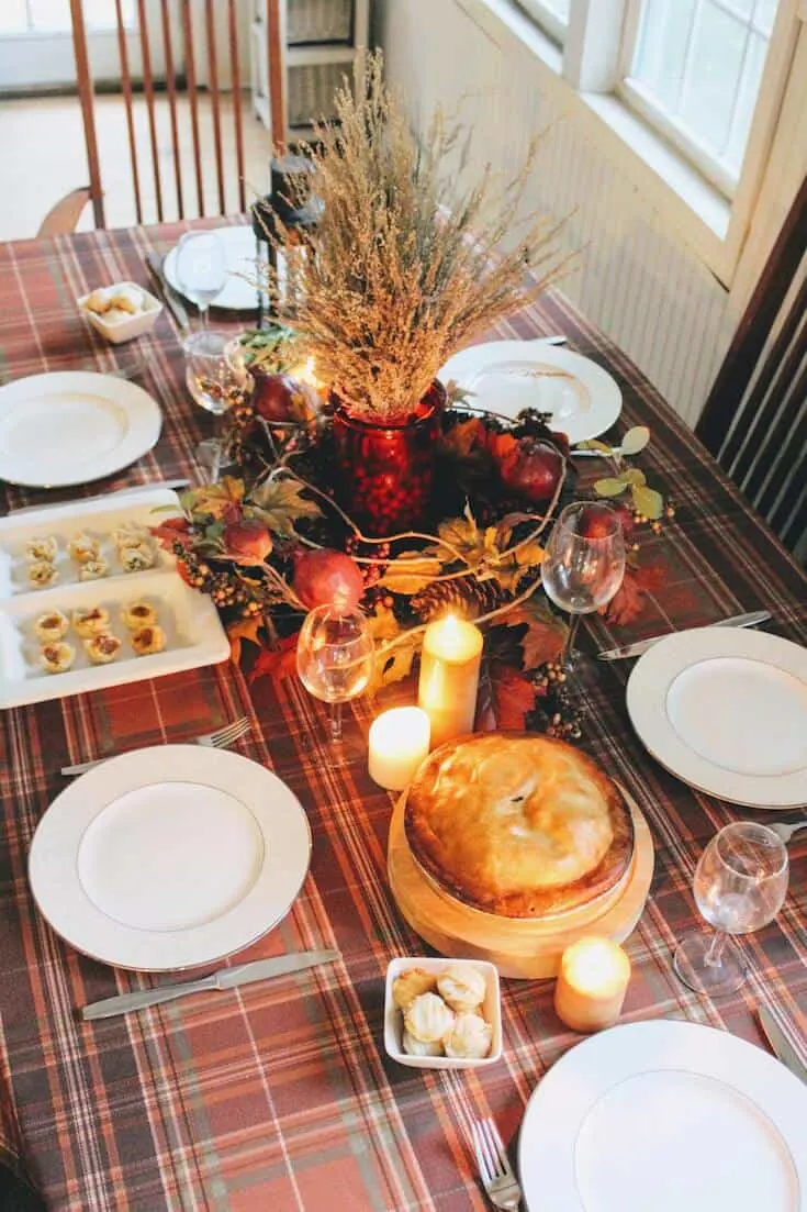 Thanksgiving dinner table with candles.