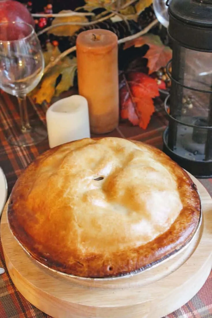 Thanksgiving pie on wooden platter.
