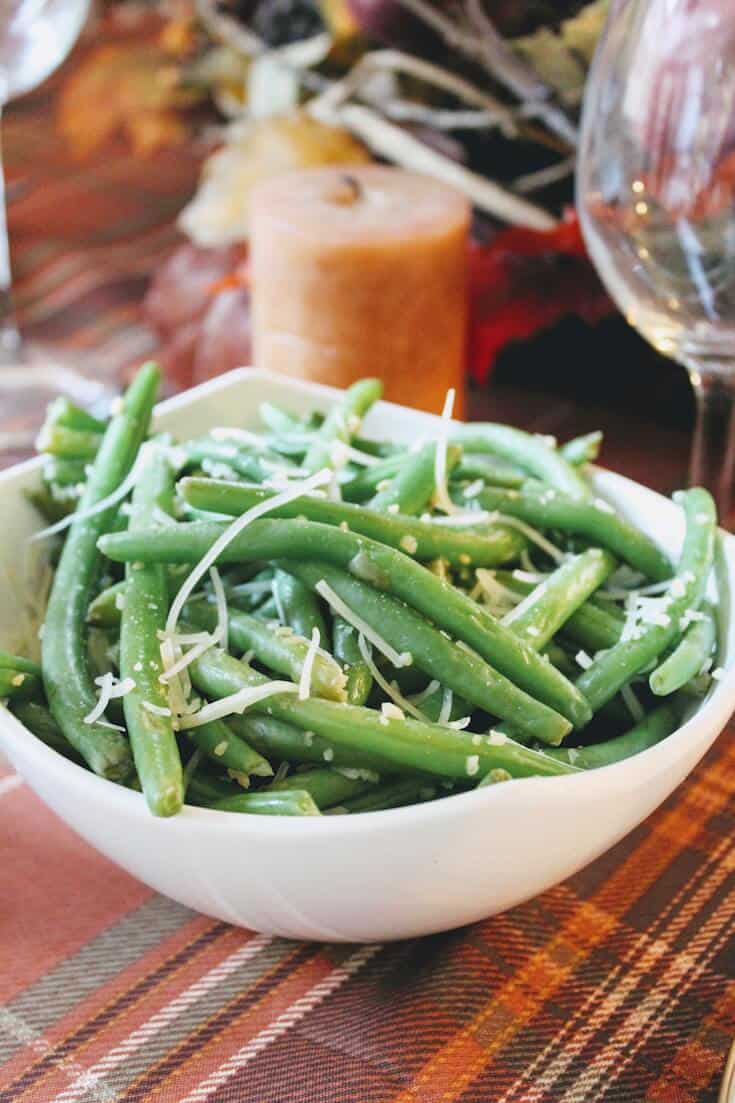 Thanksgiving green beans dish in white bowl.