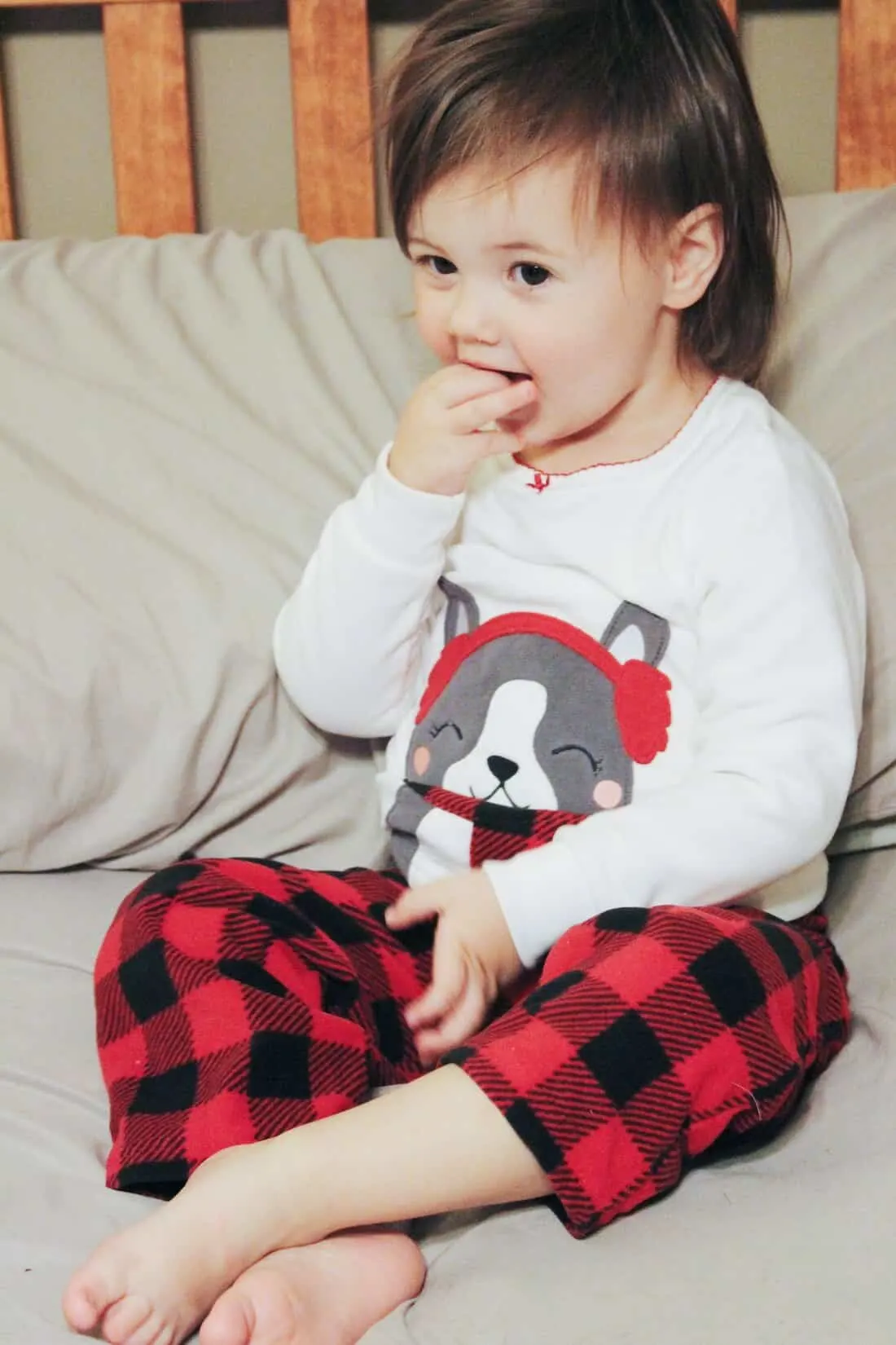 Toddler girl in two piece Holiday pajama set.