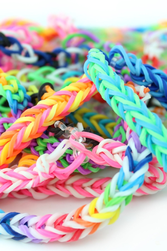 A big pile of colorful DIY kid's bracelets.