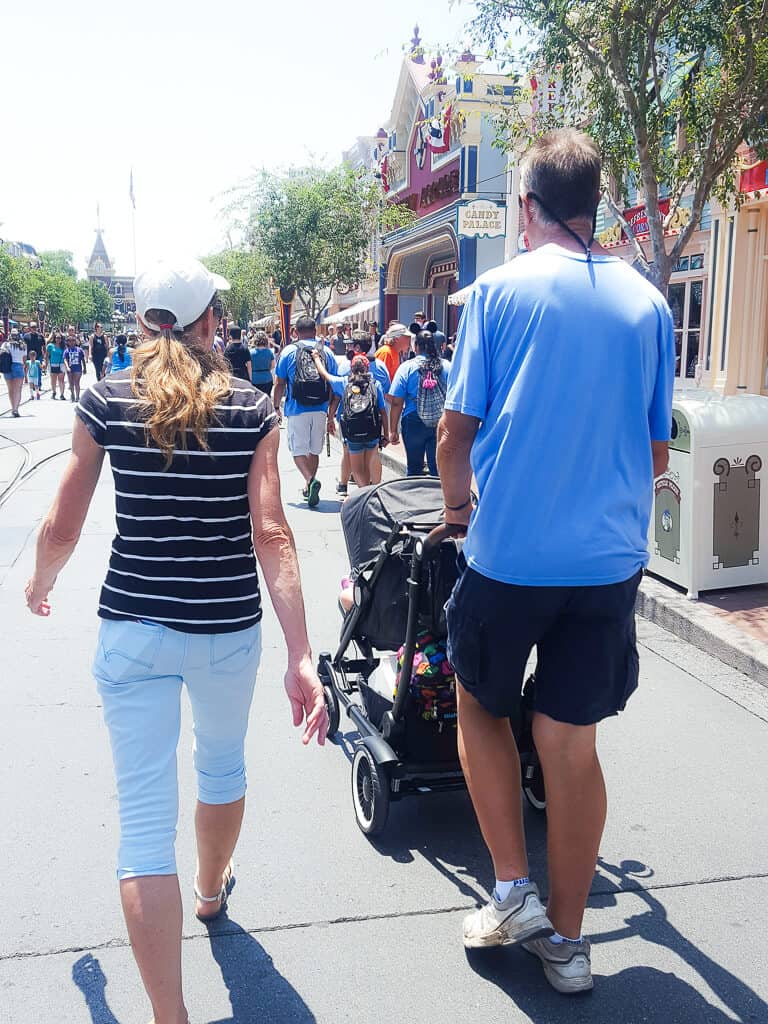 Family walks through Disney Park.