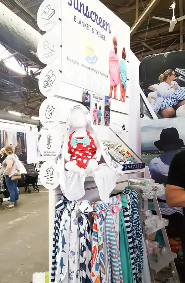 Baby clothes on display at show.