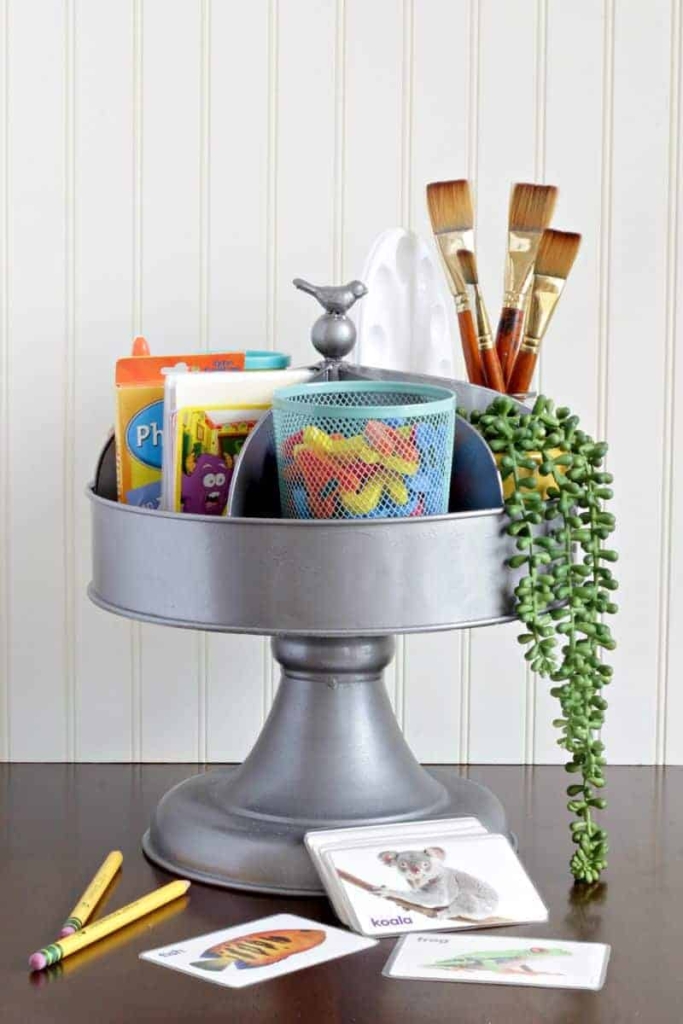 A DIY craft supplies caddy on a table.