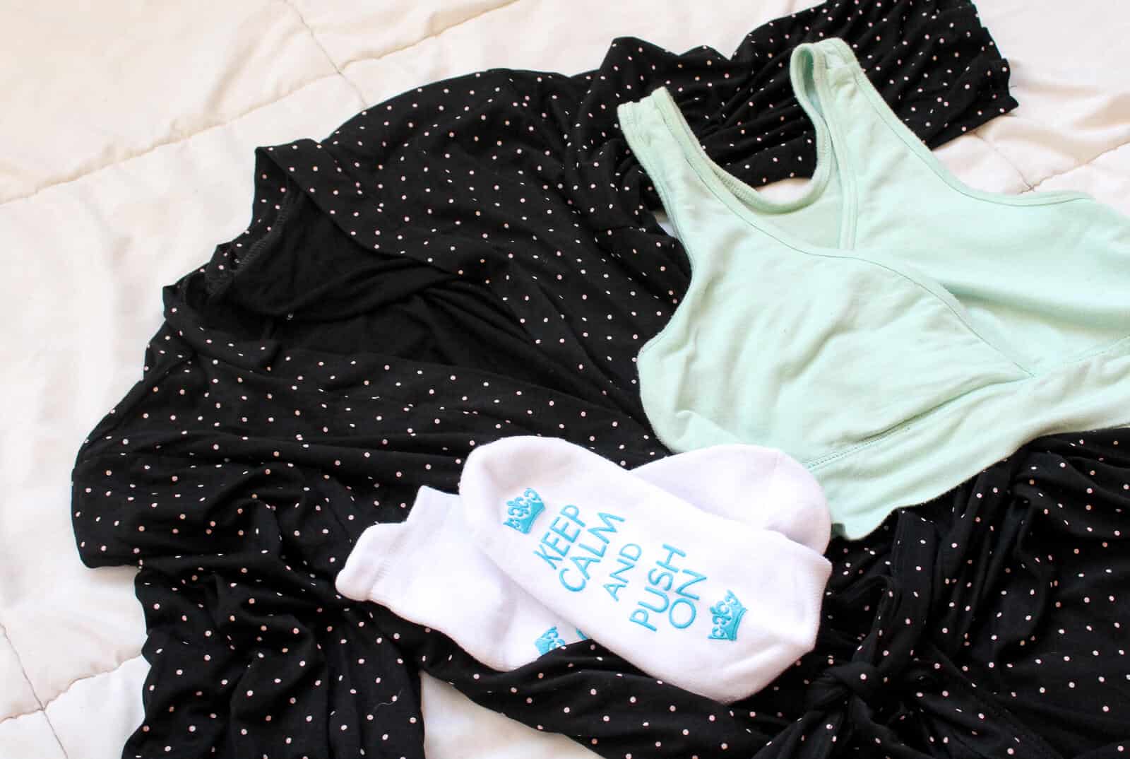 Keep calm and push on hospital socks on top of maternity clothes.