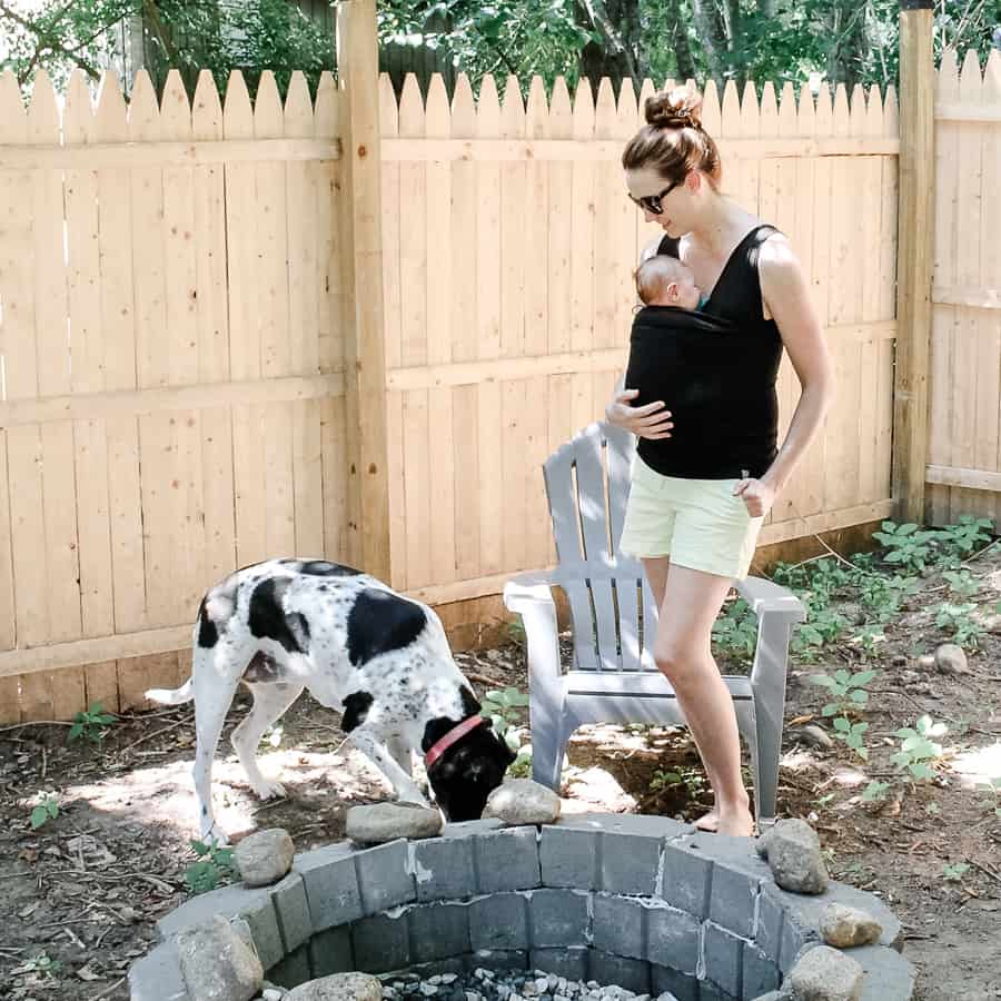 Mom with baby in Lalabu Soothe Shirt with dog outside