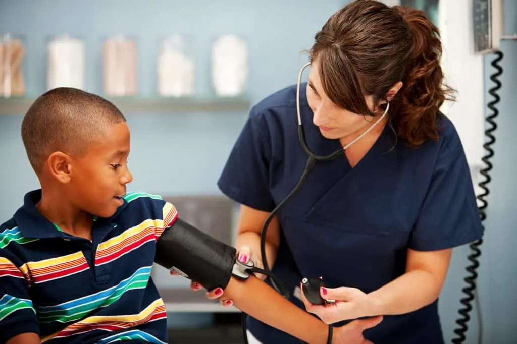 Doctor with boy patient.