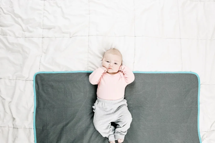 baby on a swaddle blanket