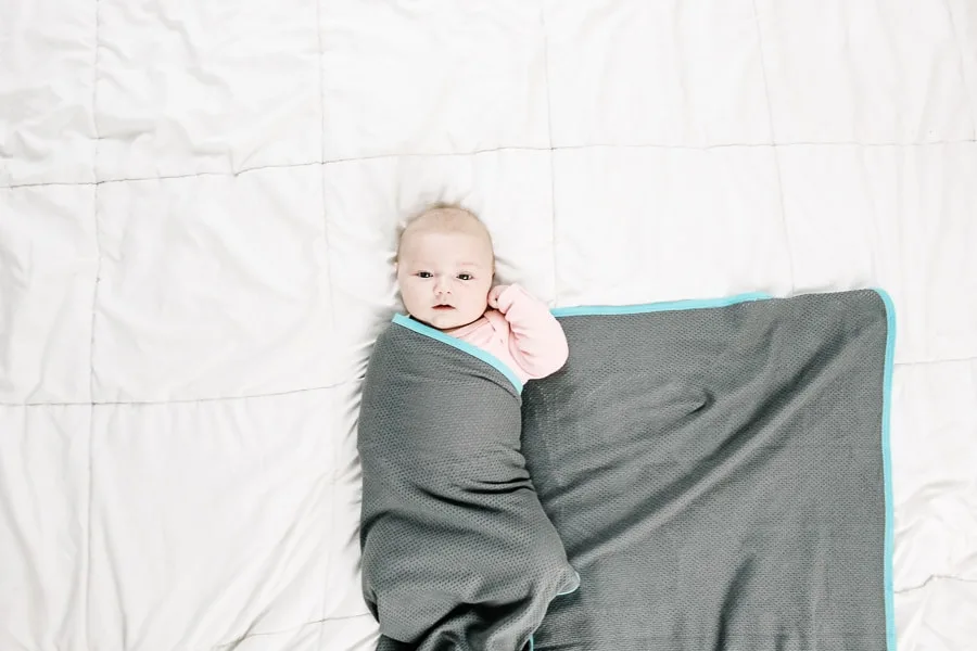 baby with a swaddle blanket folded over