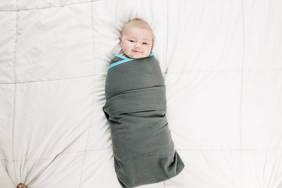 Baby is swaddled for step by step tutorial.