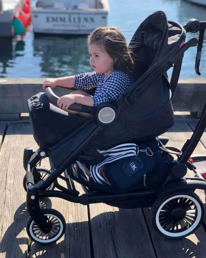 Baby in stroller on dock in Massachusetts. 