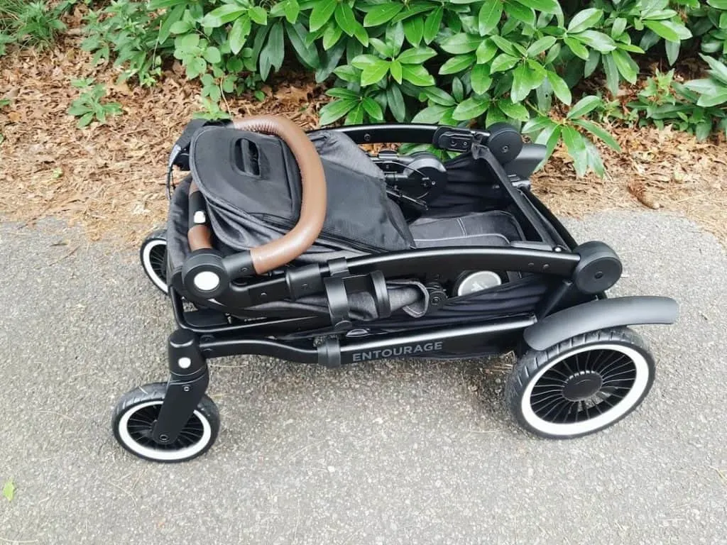 Folded up stroller on walking path.