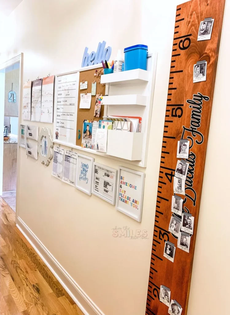 A command center in a hallway with a bulletin board and white board.