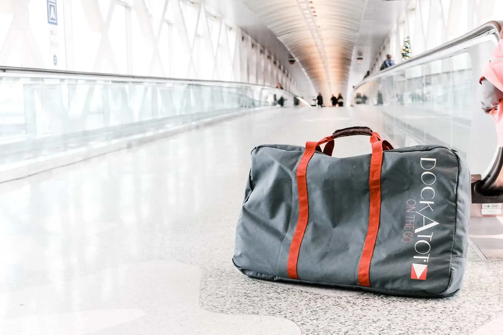 travel with a dockatot transport bag in airport
