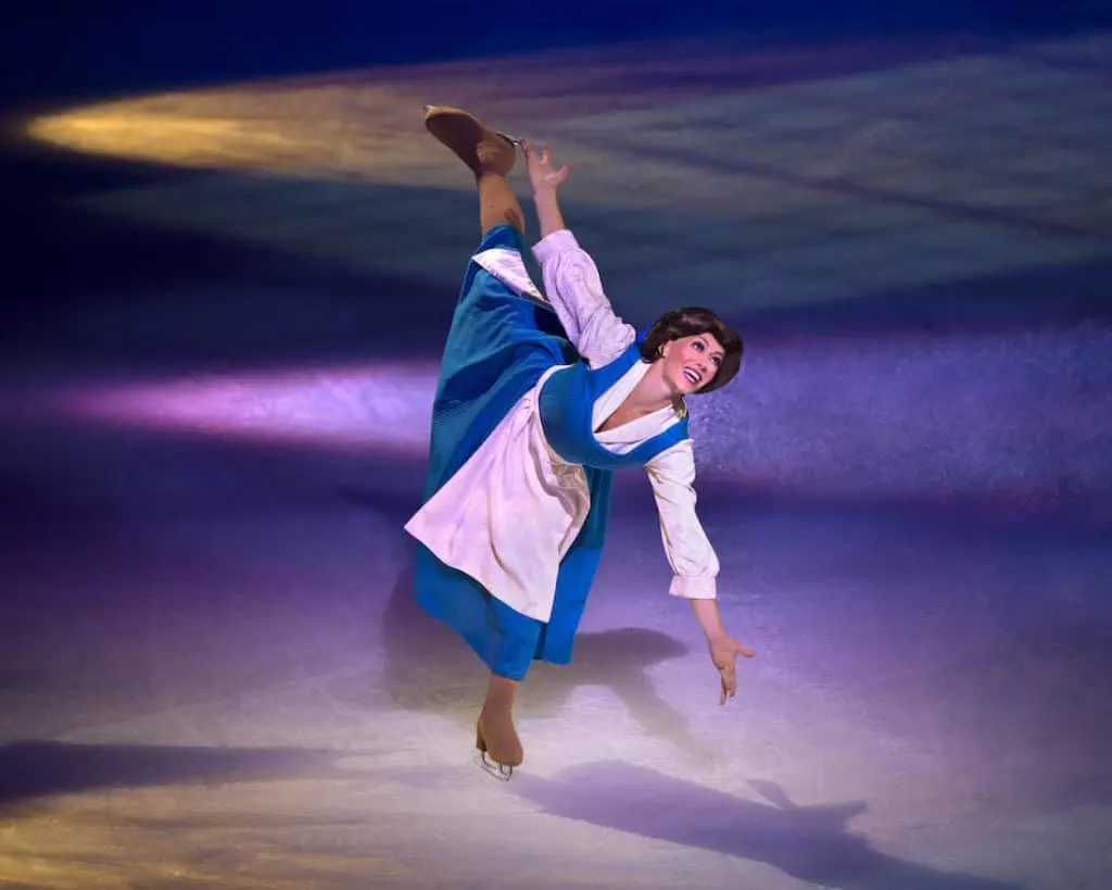 Women dressed as Disney character skates on ice.