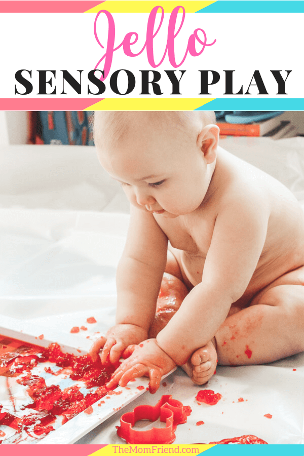 baby playing with jello as a messy sensory play activity with text Jello Sensory Play
