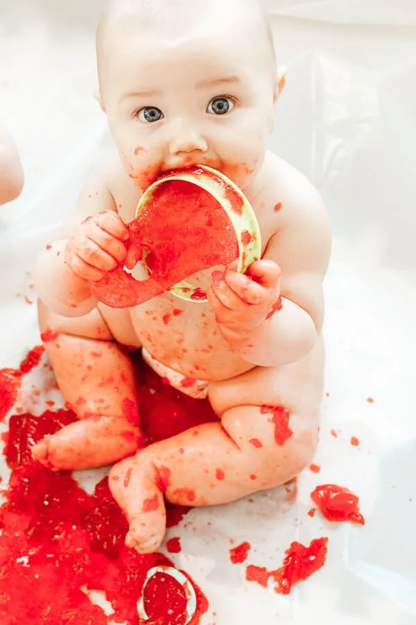 Baby chews and play tool covered in red Jello.