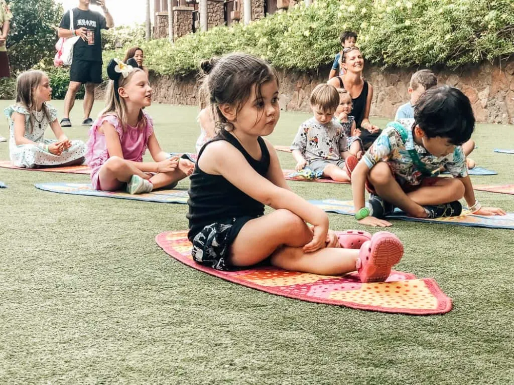 Children participate in group outdoor activity at Disney resort.