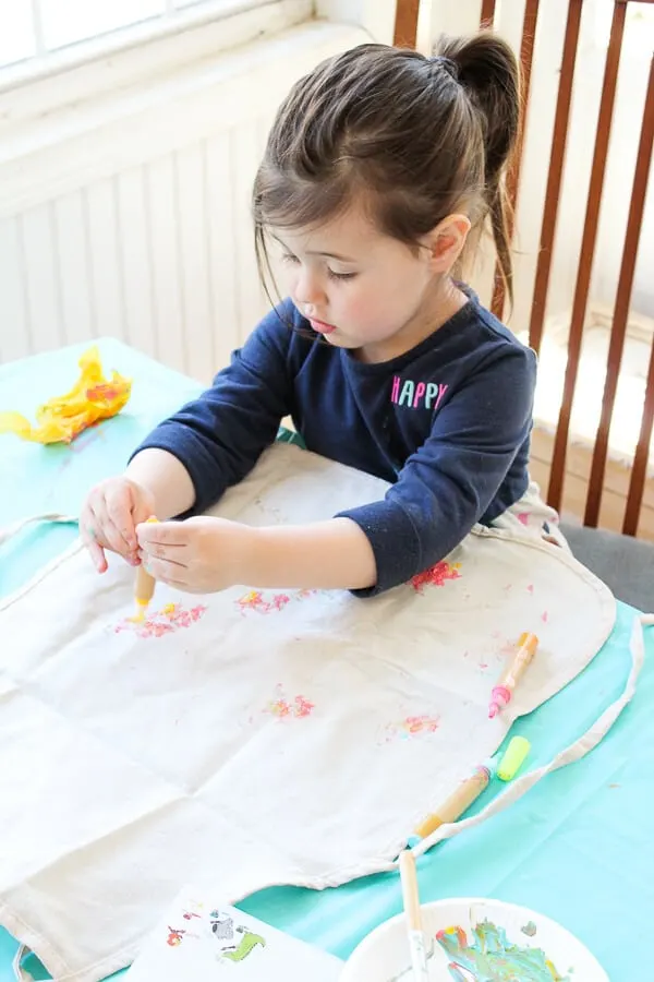 Girl decorates using spring products for kids and moms.