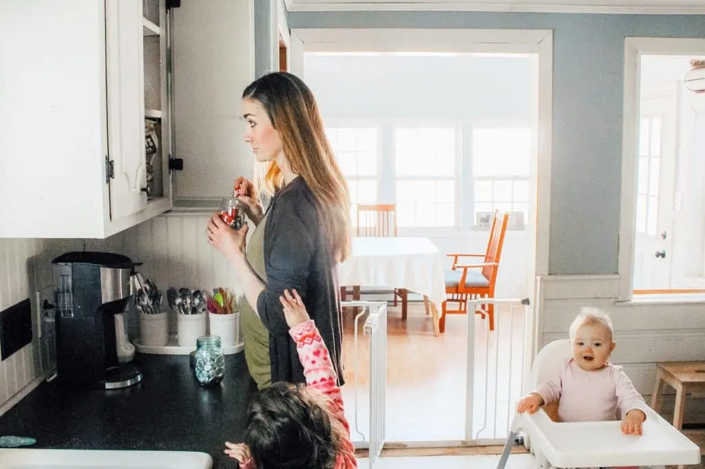 Mom tries to sneak chocolate away from child.