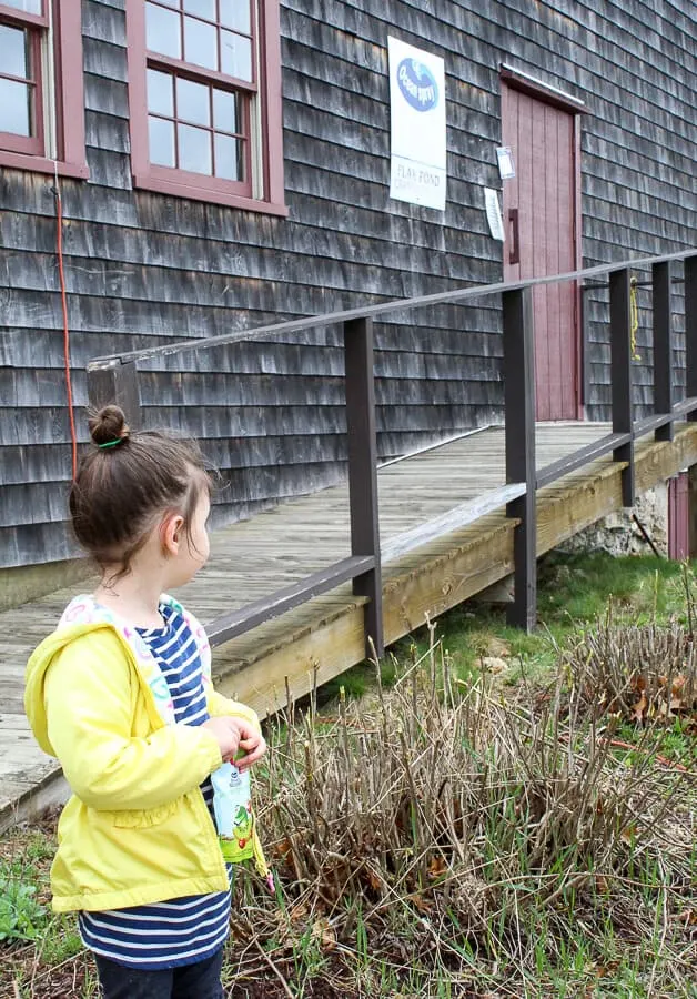 Girl with Ocean Spray Growing Goodness Juice drink at cranberry bog