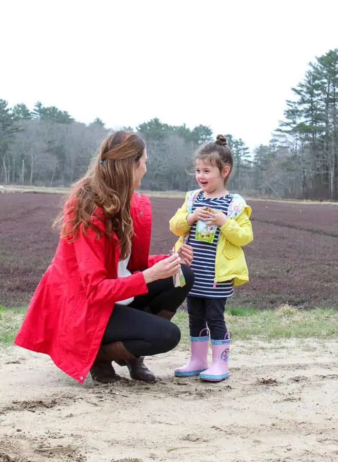 Mom and Girl with Ocean Spray Growing Goodness Juice drink at cranberry bog