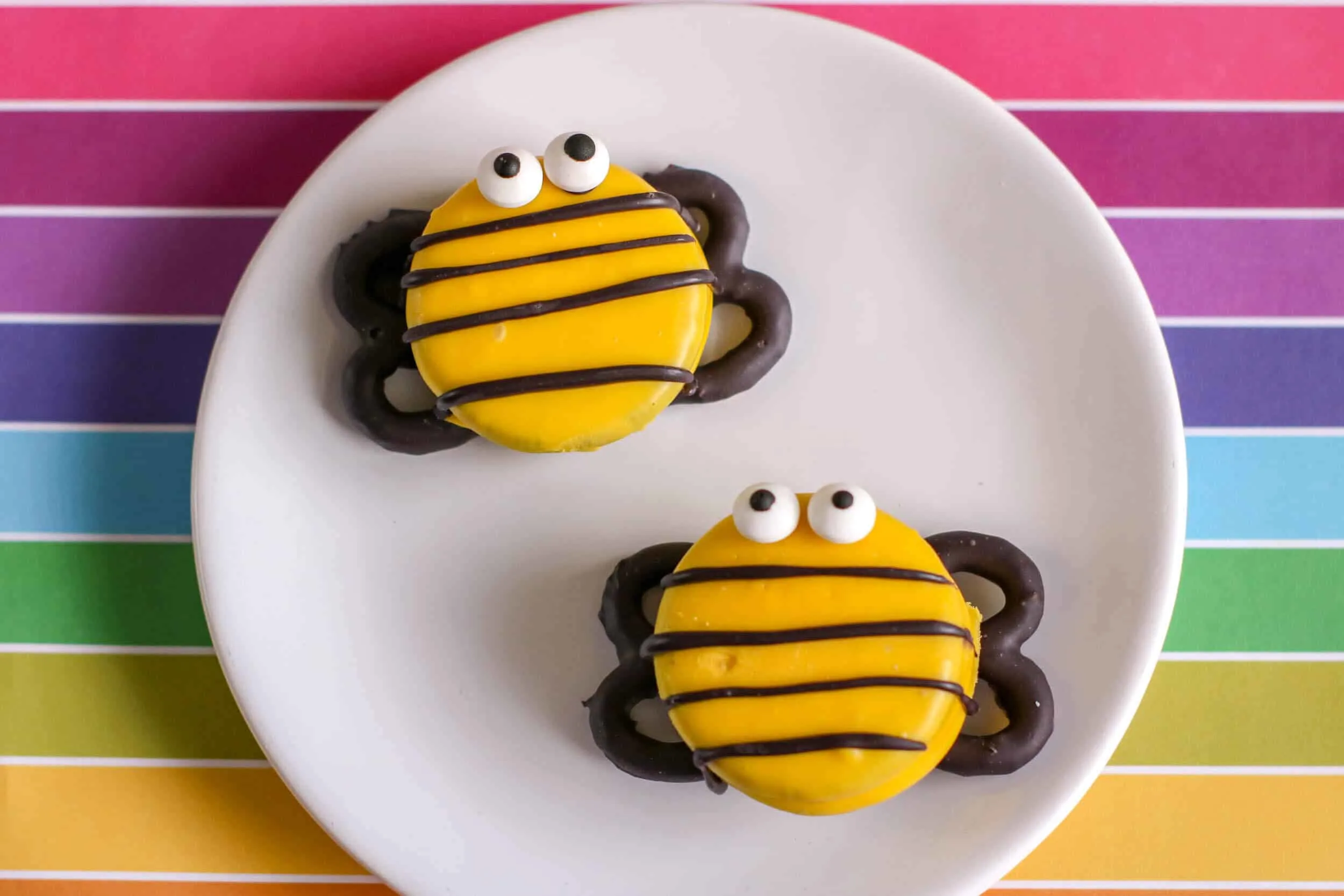 Bee decorated cookies on plate.
