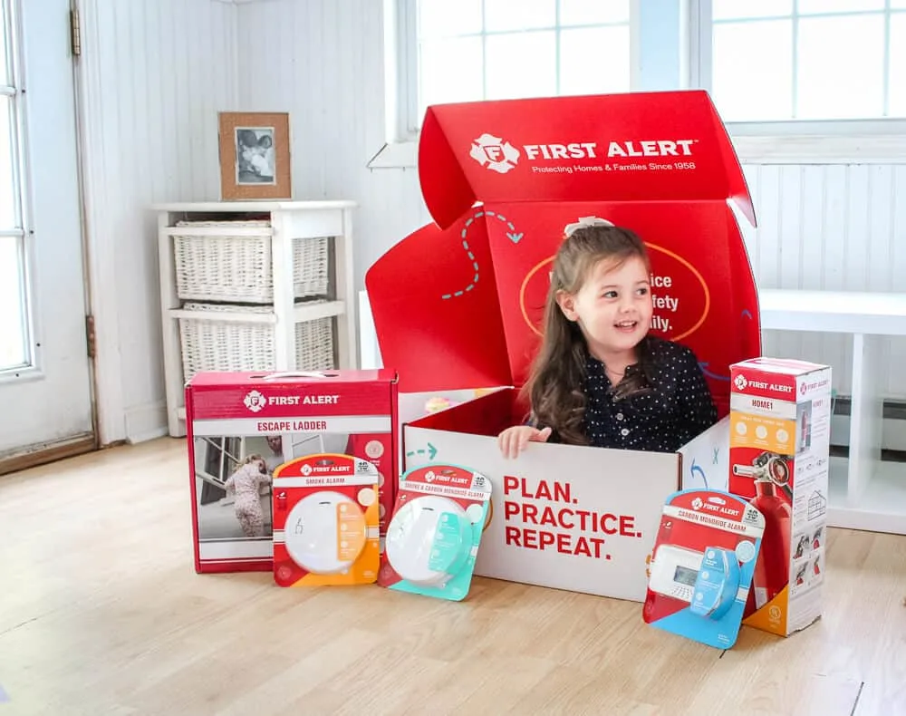 Child plays in First Alert emergency plan box.