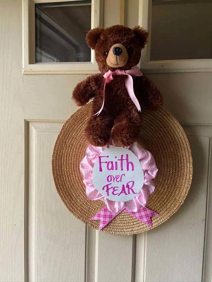 Teddy bear on front door for neighborhood bear hunt activity.