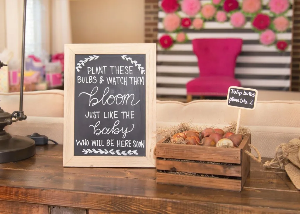 Flower bulbs in a mini wood crate for baby shower favors.