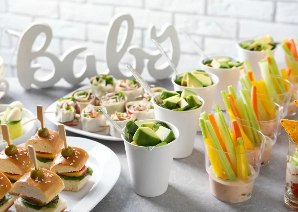 Party appetizers in cups and on serving platters.