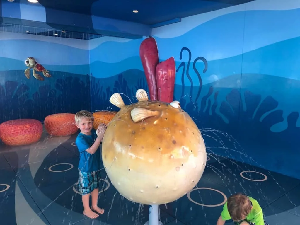boy standing a Nemo's Reef on Disney Dream cruise