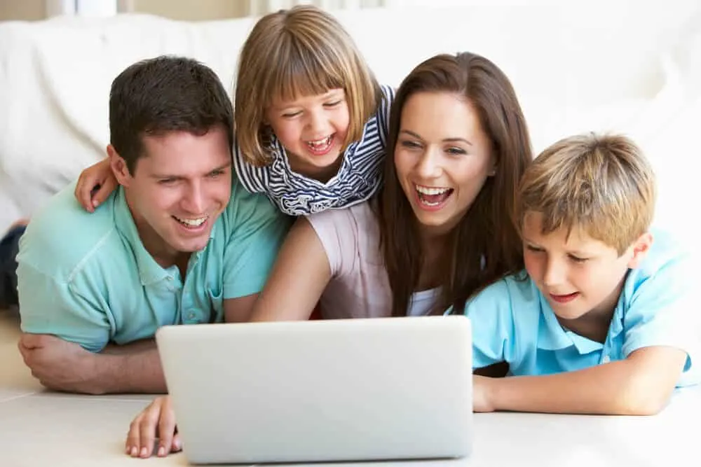 Family happy at the computer.