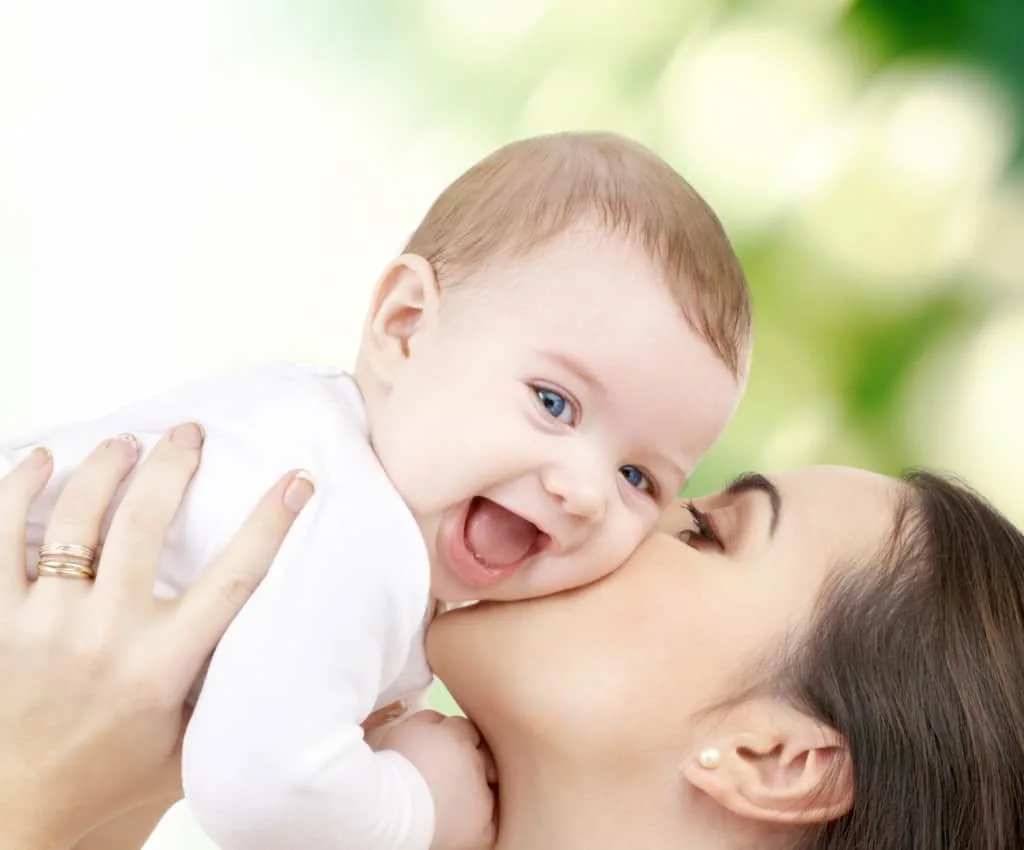 Mother with baby boy in nature.