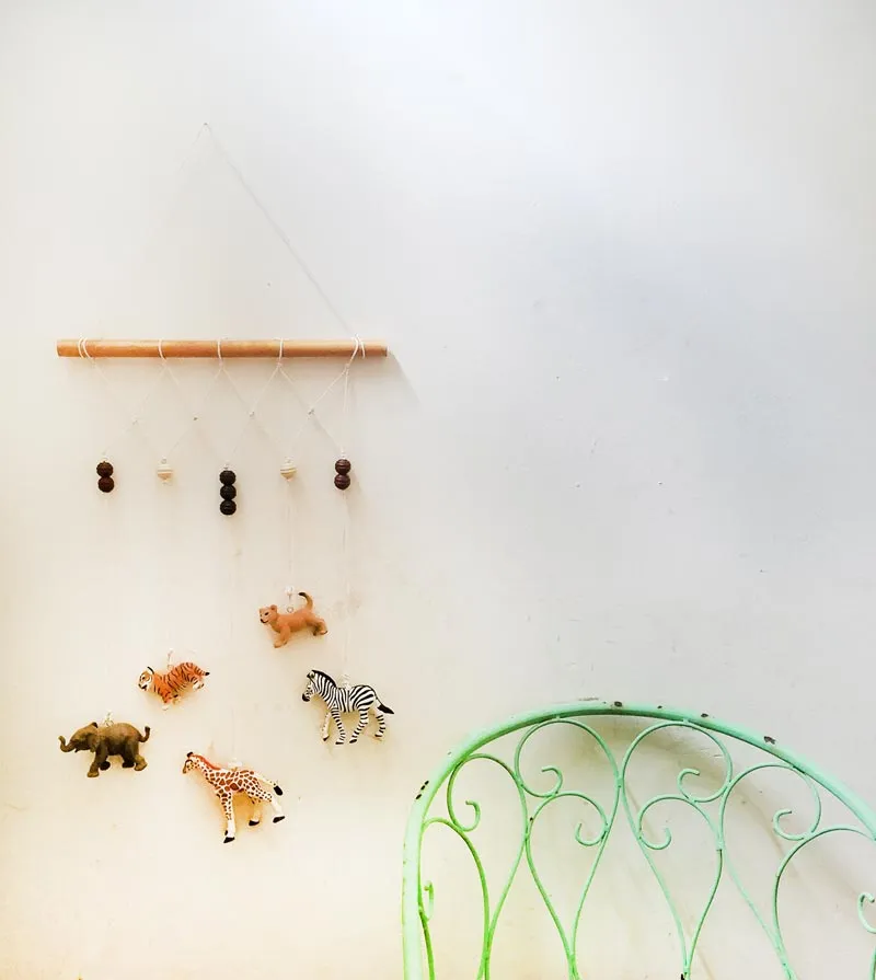 A DIY animal wall hanging with zoo animals.